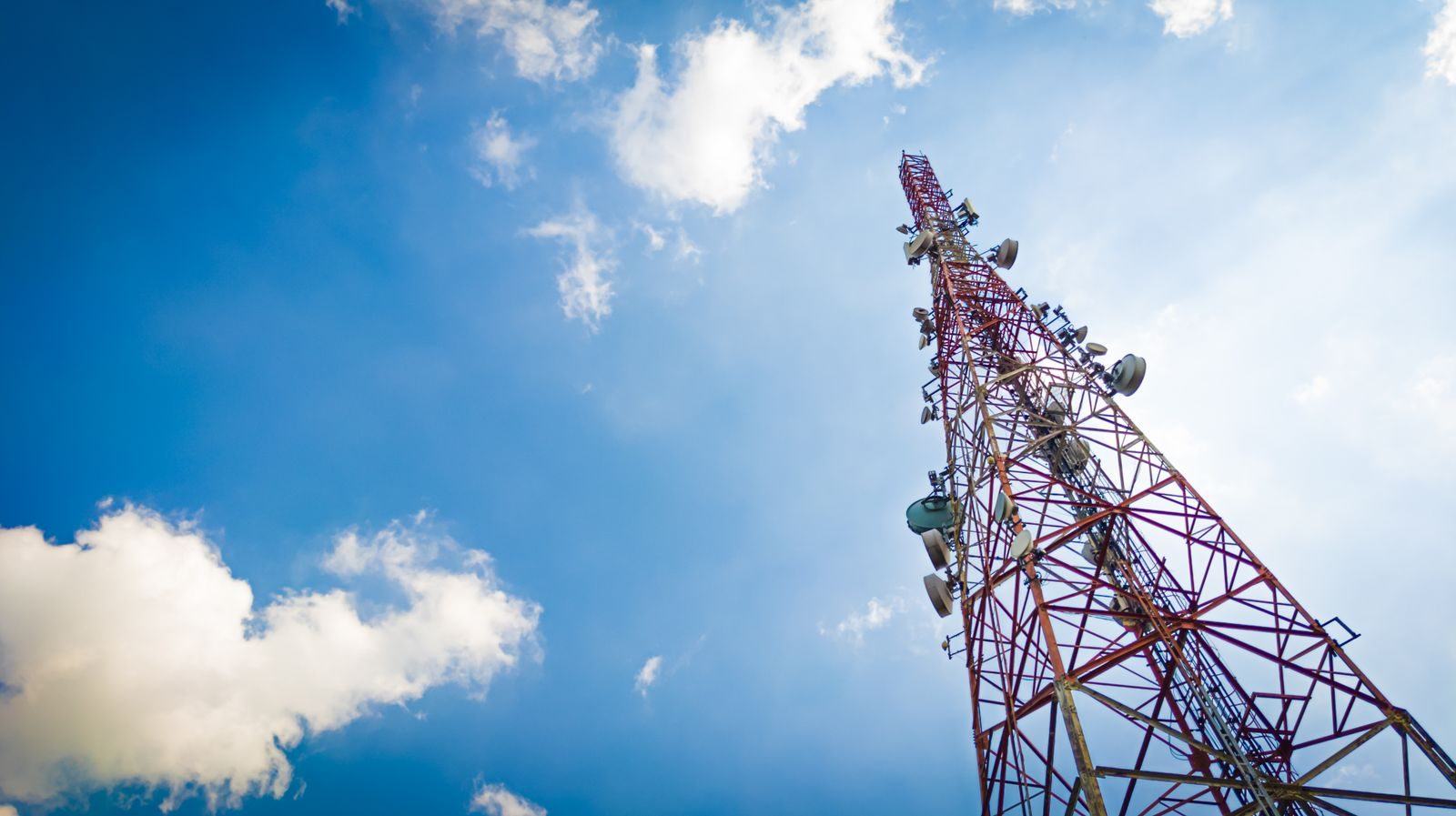 Telecommunication tower against a blue sky